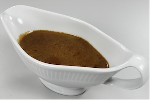 A white tub of brown gravy
